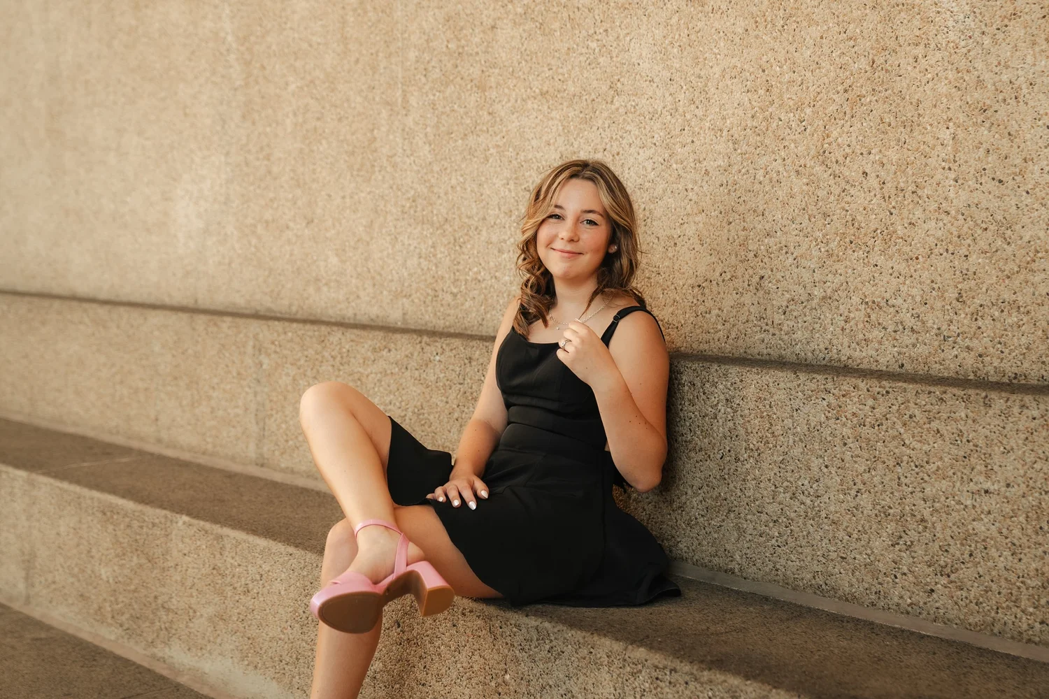 Senior photographed in a black dress by LY Photography Co