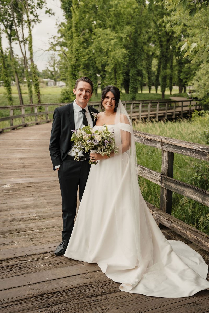 A couple photographed during golden hour on their wedding day