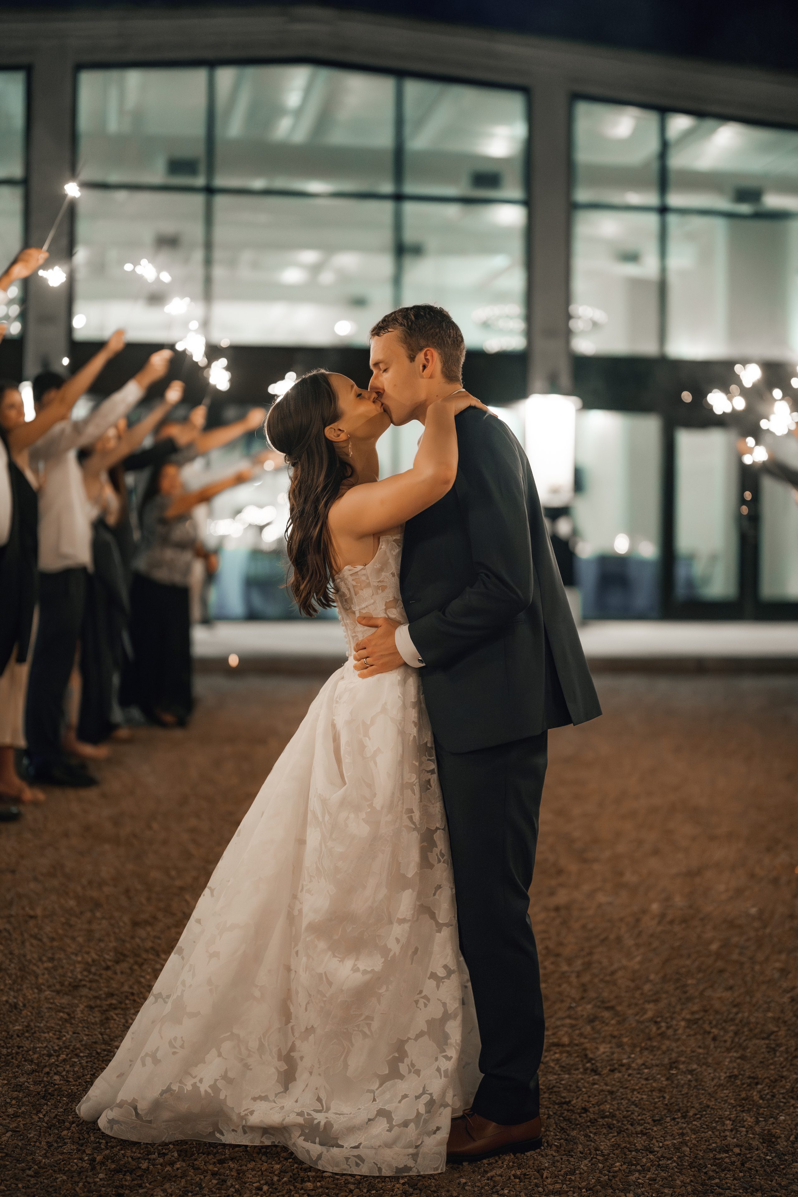 Katie and Zach kissing during their sparkler exit
