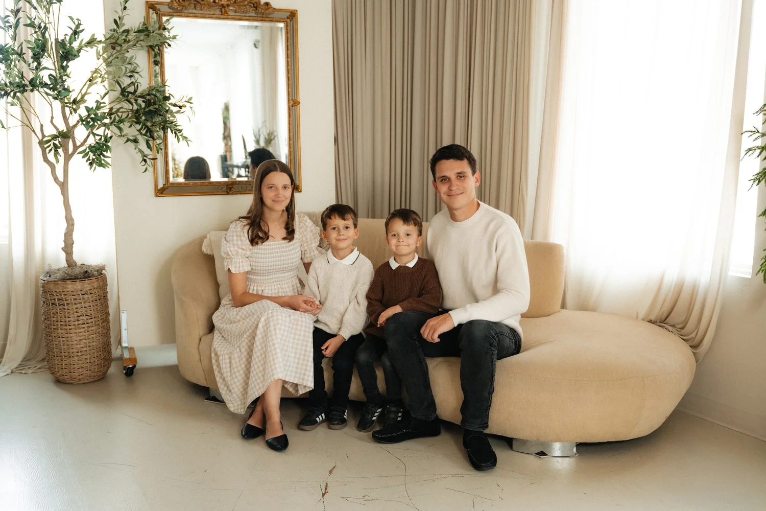 Family photographed together in a bright studio