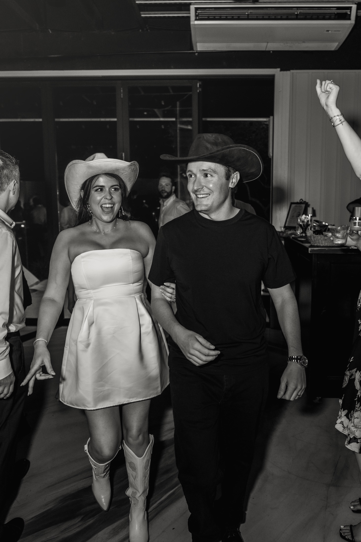 Carleigh and Connor entering the dance floor in cowboy hats