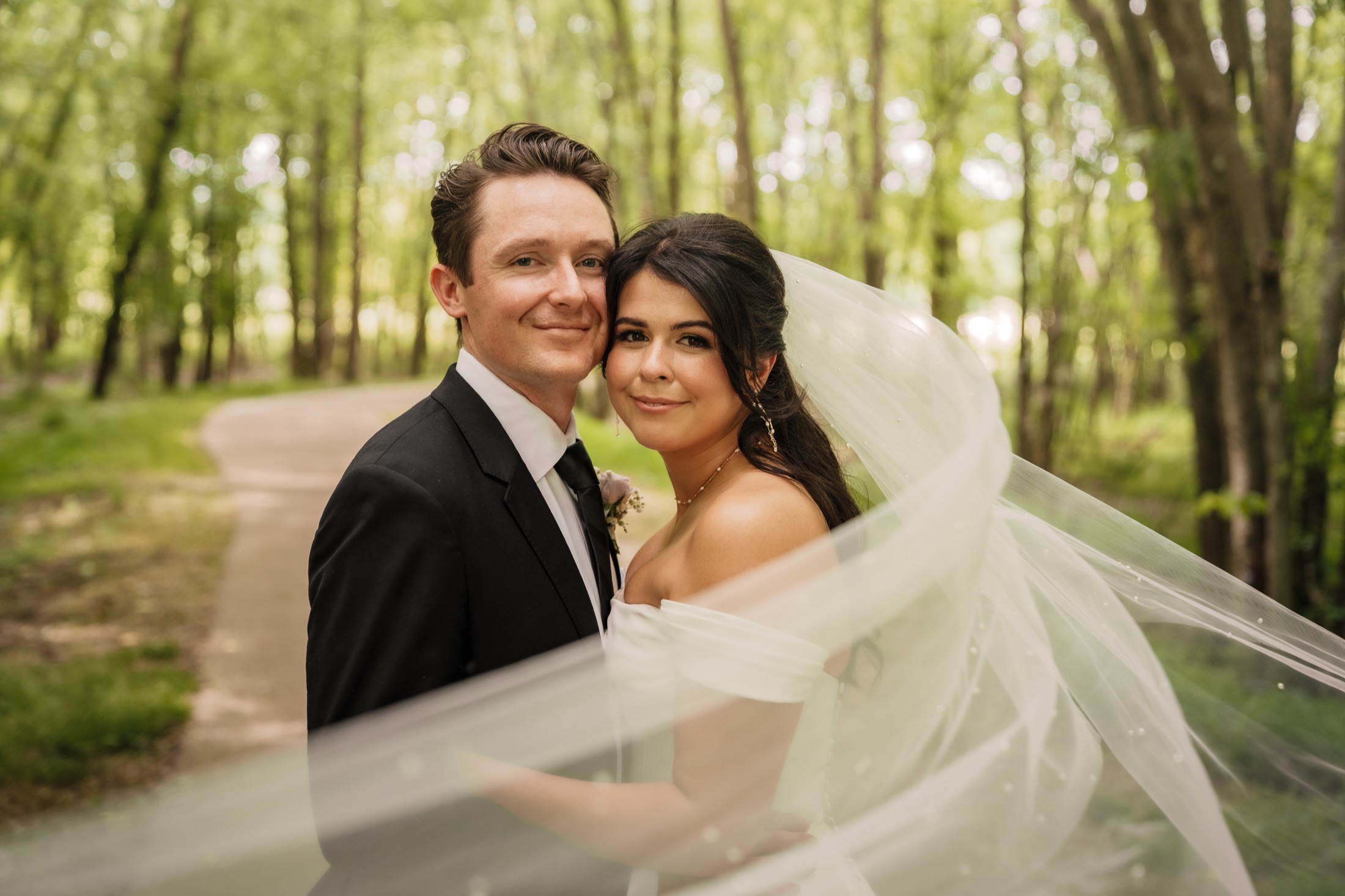 Carleigh and Connor together beneath her veil