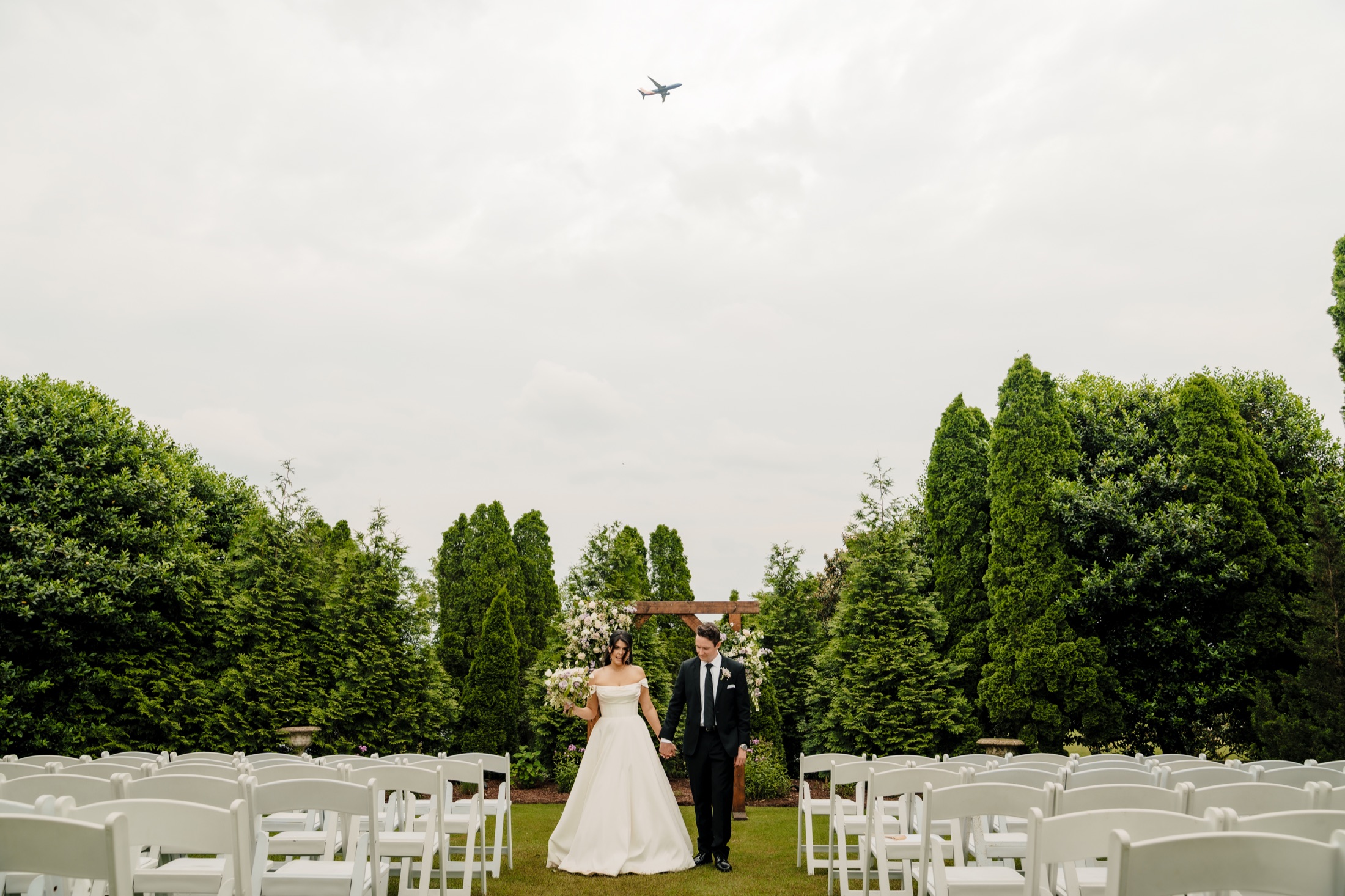 Carleigh and Connor walking down the ceremony aisle