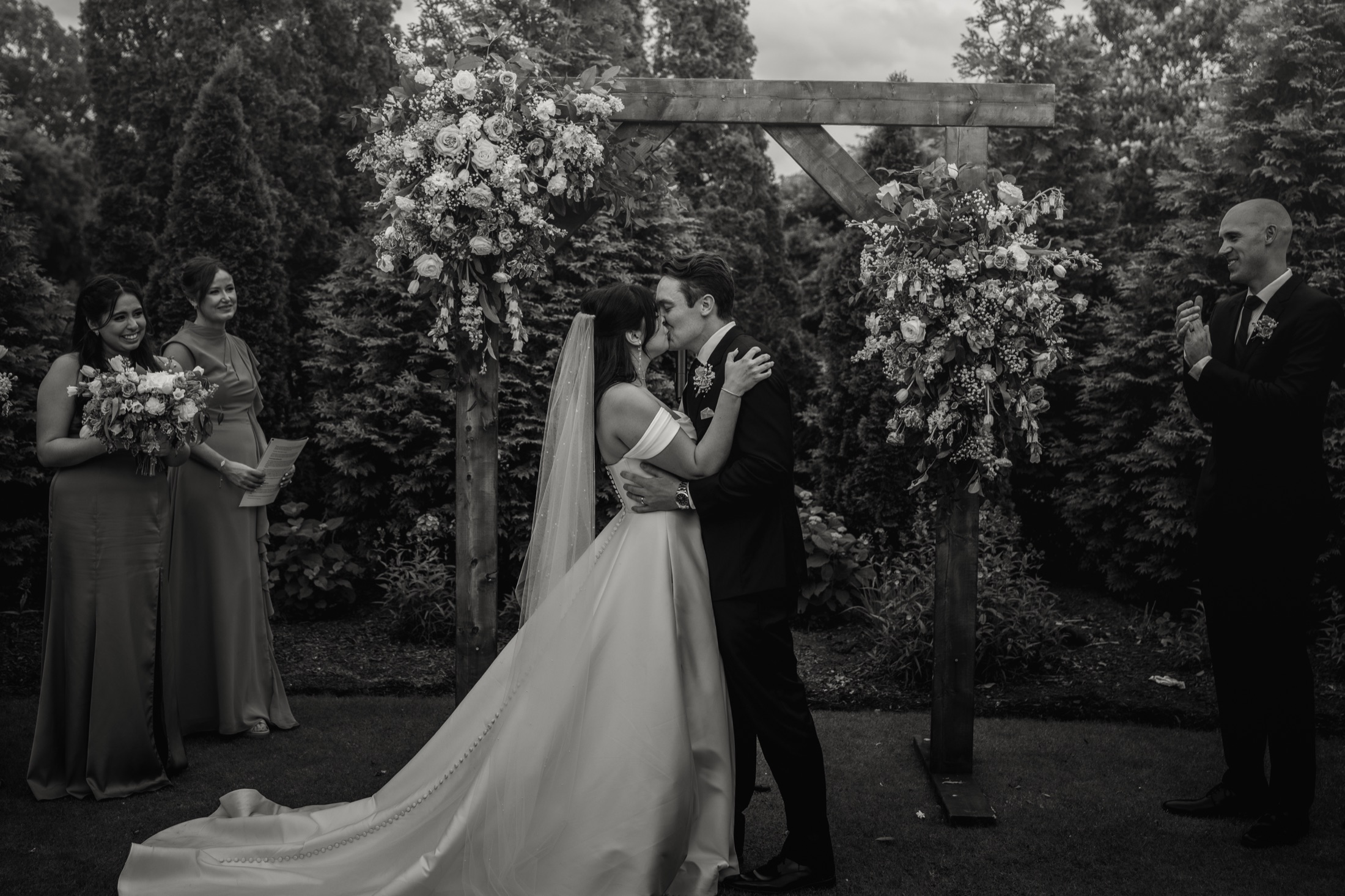 Carleigh and Connor kissing during their ceremony