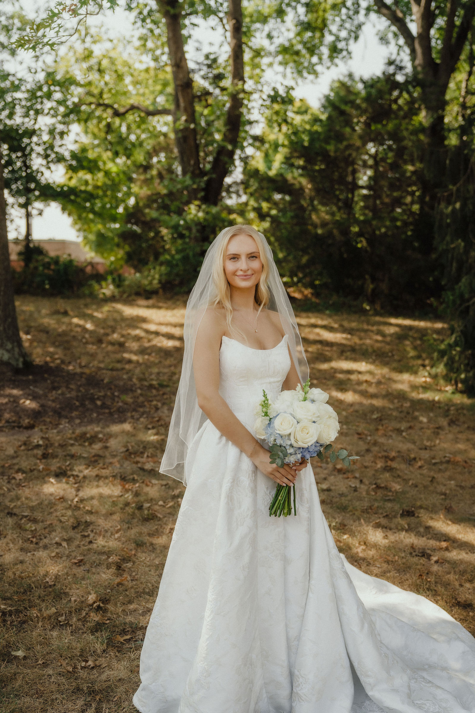 Denalyn outside under the trees before the ceremony