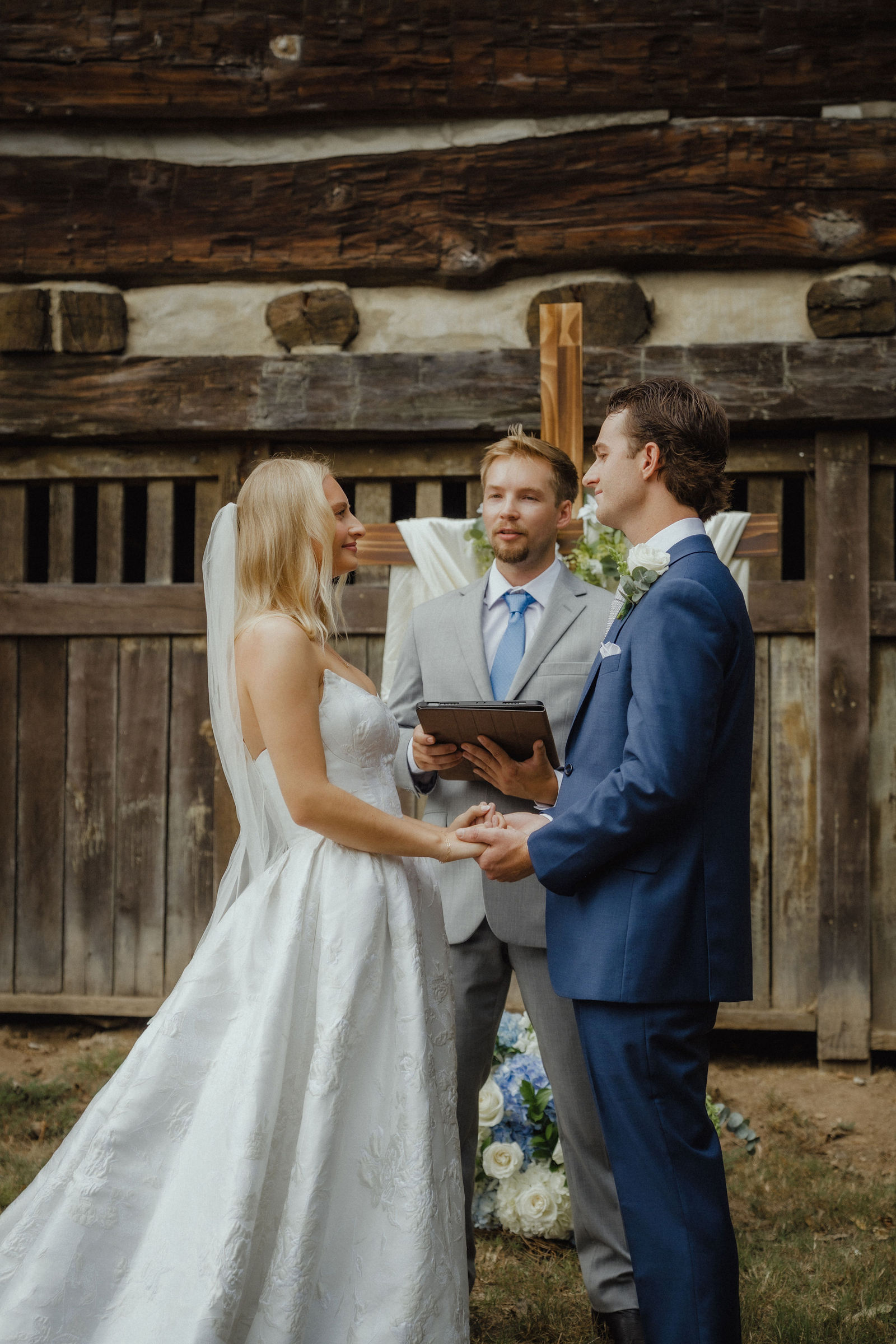 Exchanging rings in front of the log wall