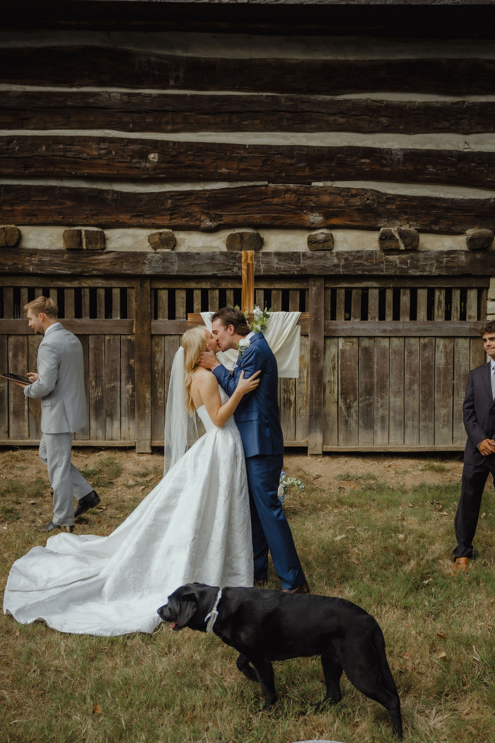 The first kiss, with their Lab walking through the back of the frame