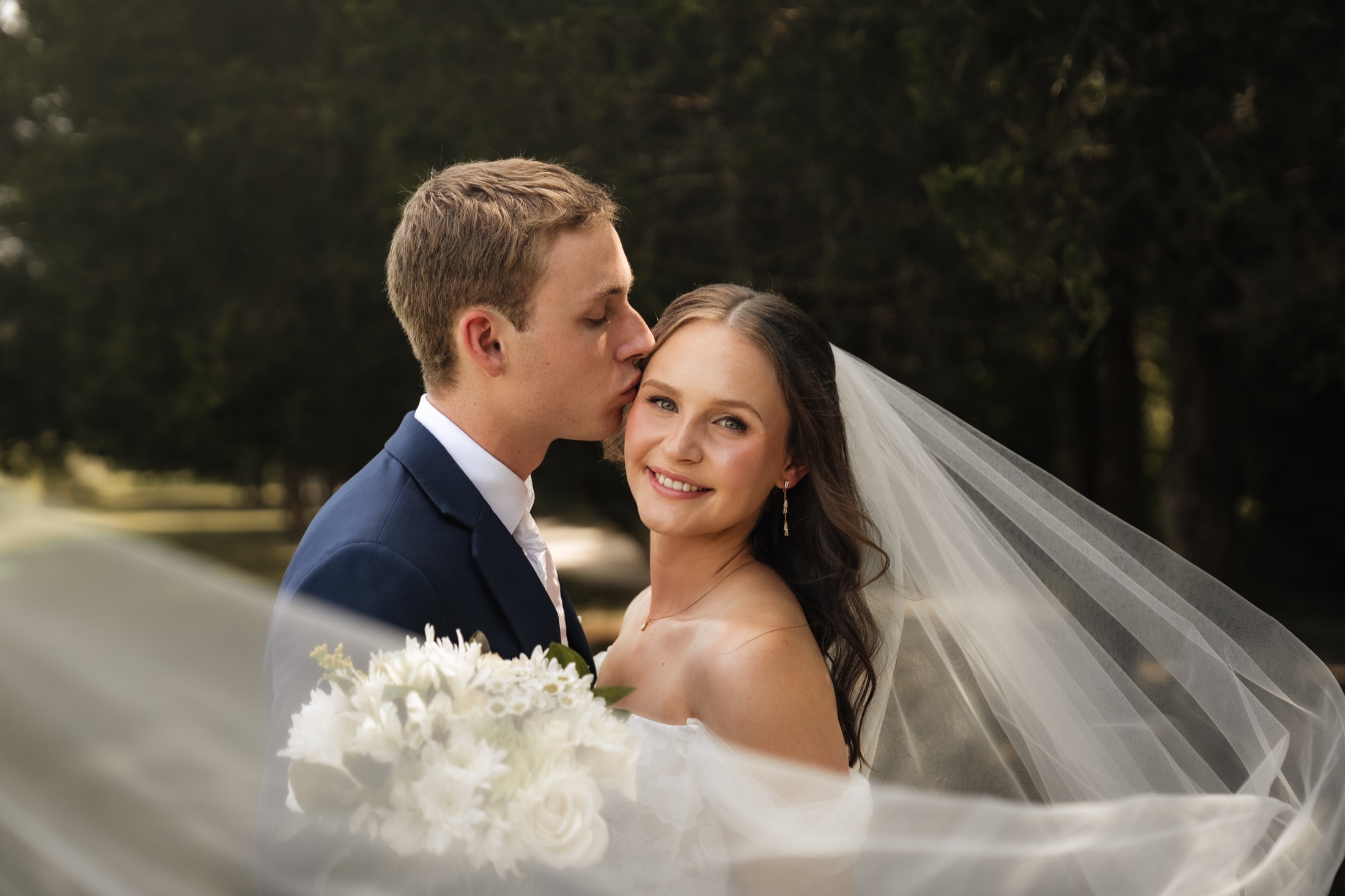 Katie and Zach sharing a close portrait outdoors
