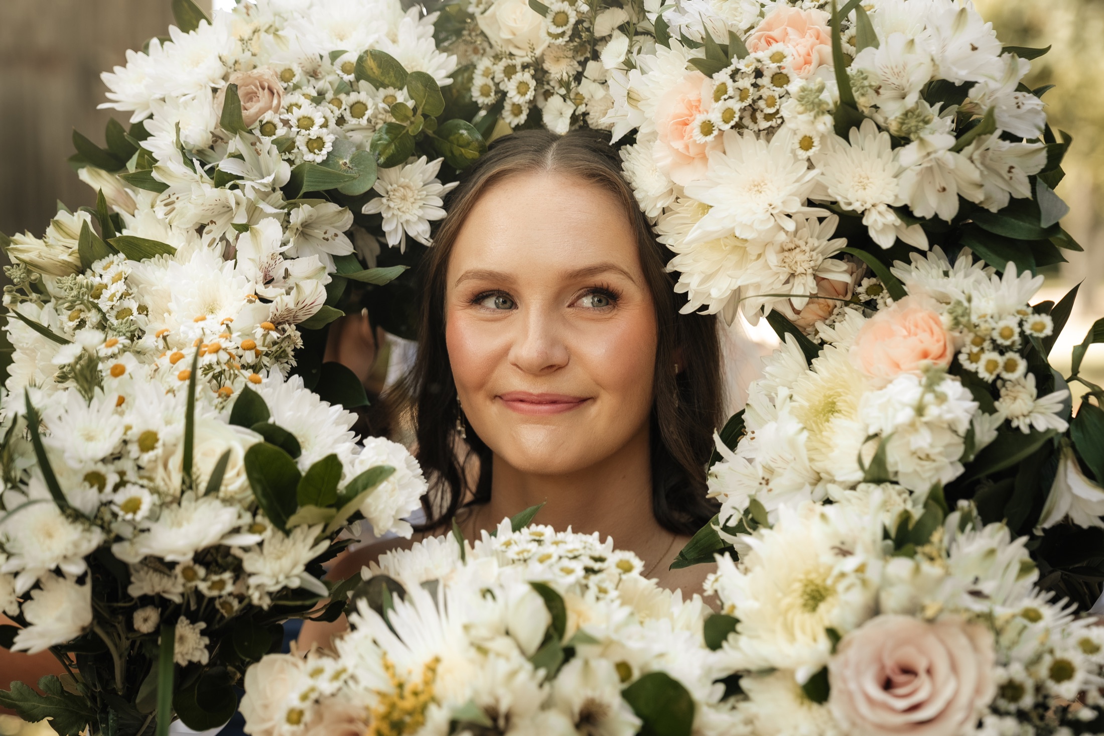 Katie framed by white flowers at Southall Meadows