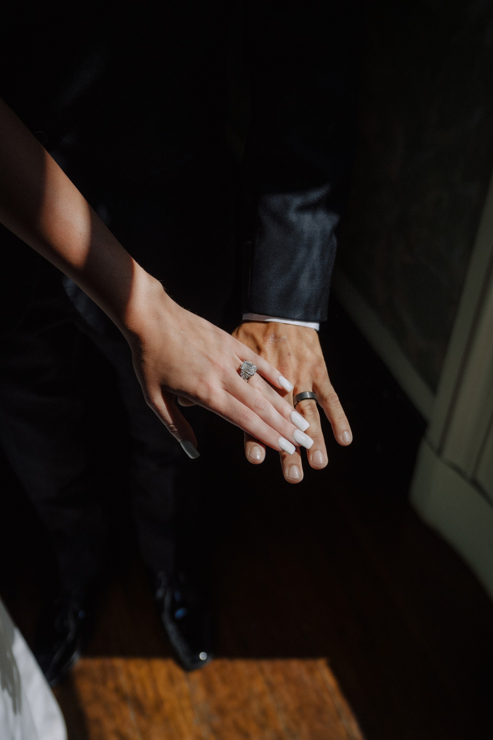 Their rings, his hand over hers