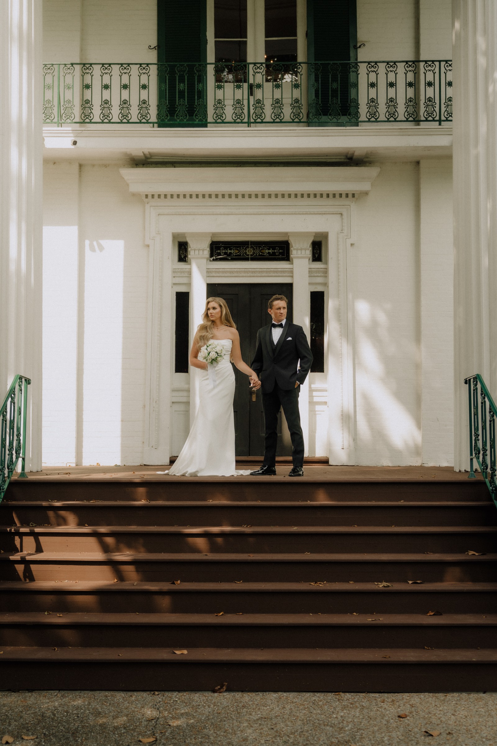 Maddie and Brandon on the front steps of the mansion
