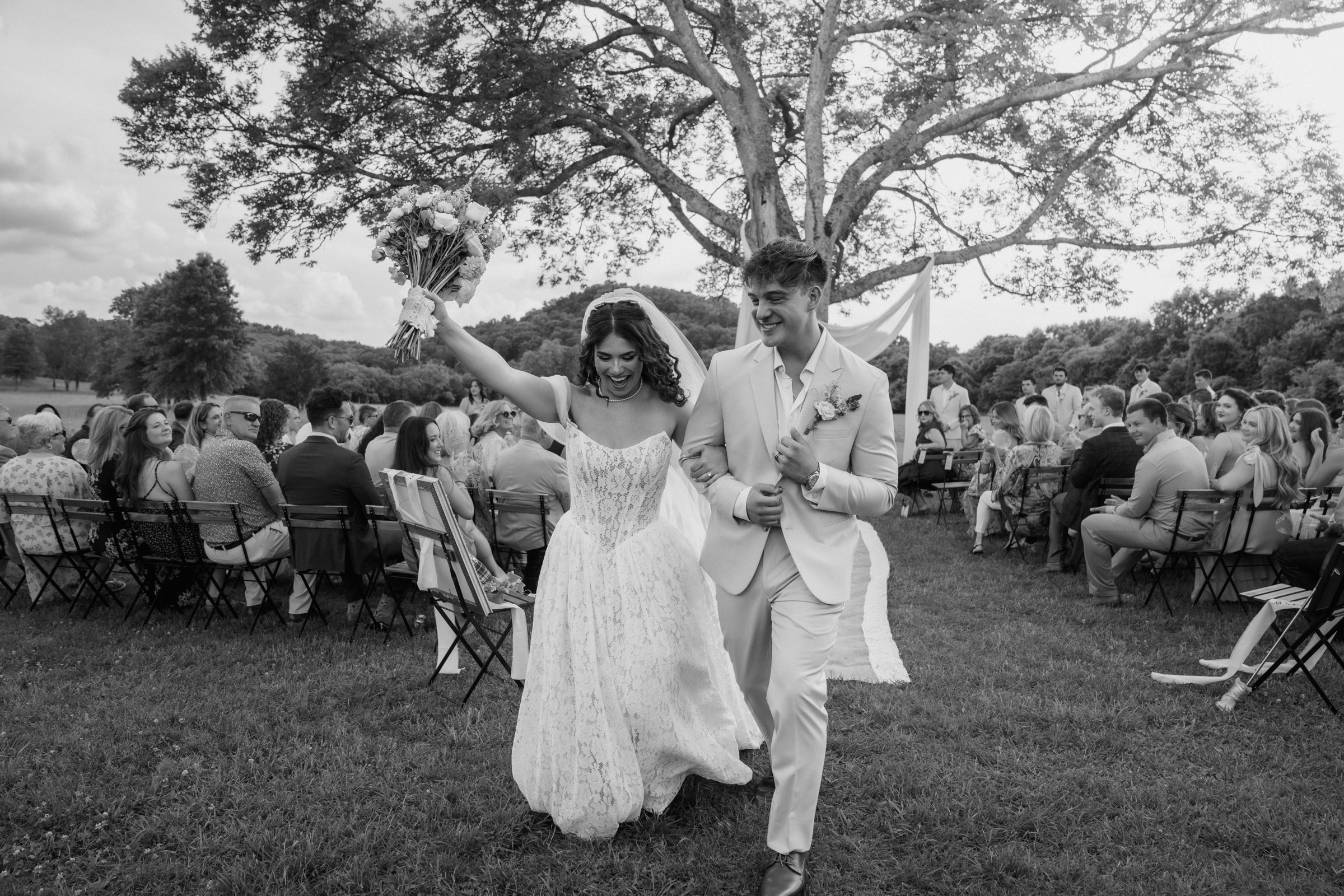 Presley and Jack walking back up the aisle just married